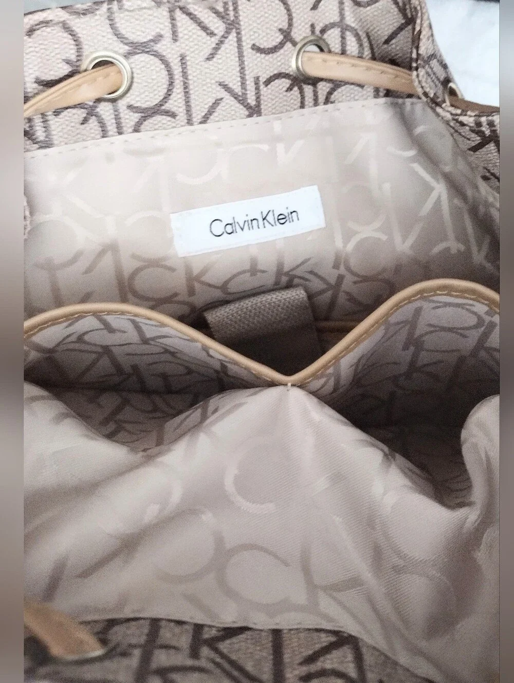 Calvin Klein Monogram Drawstring Backpack in Beige and Brown